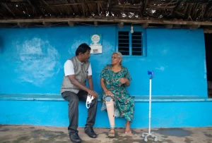 A Rotary volunteer providing healthcare services in a rural community in India