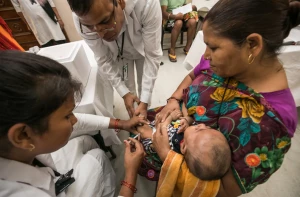 A mother and child during a polio immunization session